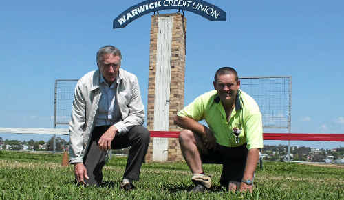 Turf club president Jim Costello and Dave Rossiter look at the ground at Allman Park.  